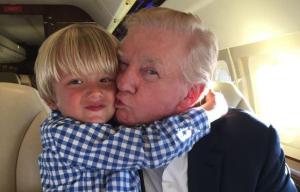 Donald Trump cuddles his young grandson Tristan as President-elect prepares for life in the White House