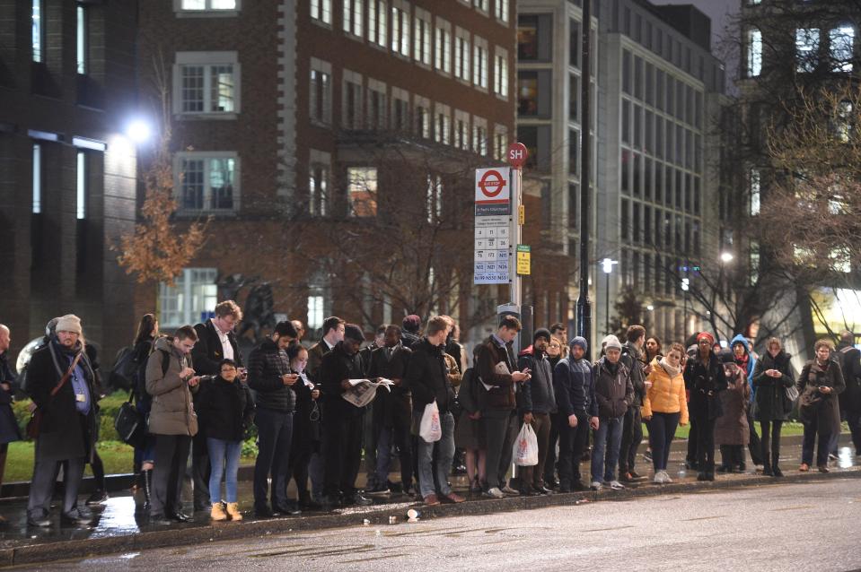 Queues form at a bus stop near St Pauls Cathedral this evening