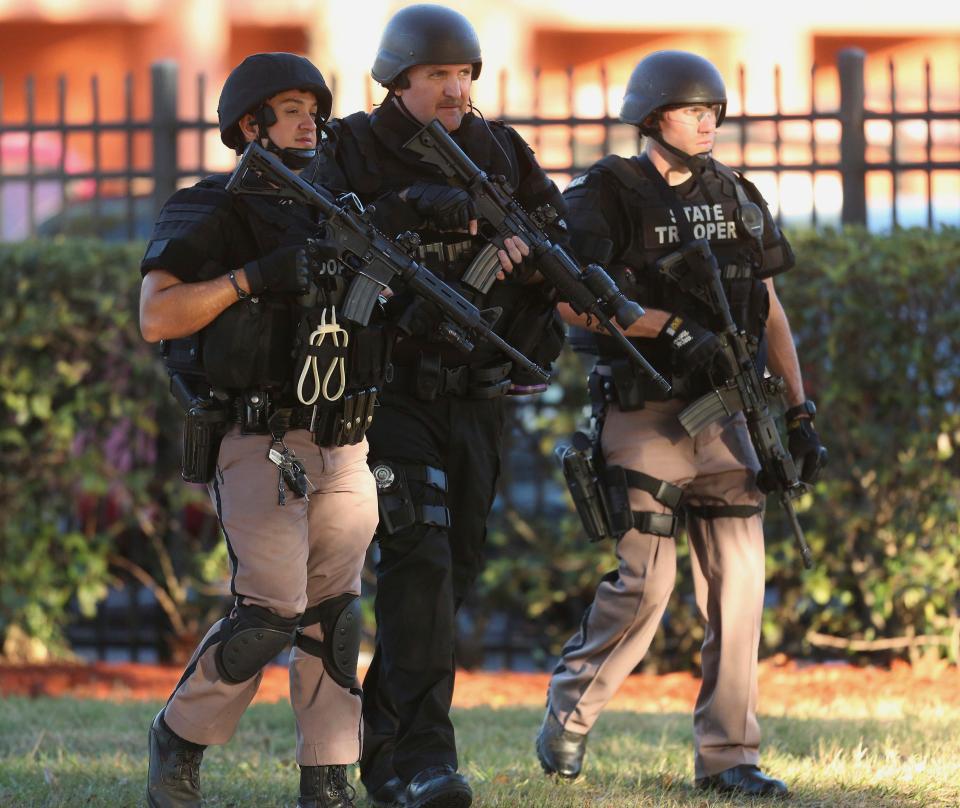  Law enforcement officers conducted a door-to-door search at an apartment complex in Orlando