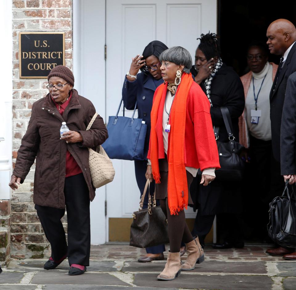  Members of the devastated church were pictured leaving the hearing during a break on Tuesday