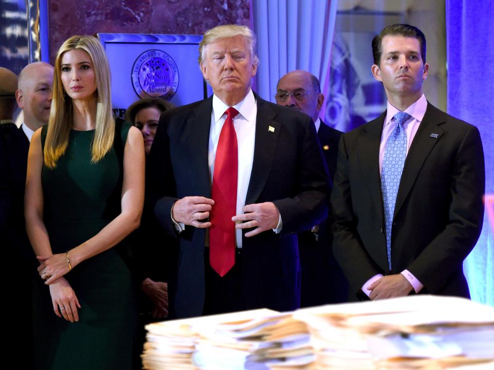 US President-elect Donald Trump stands with his children Ivanka and Donald Jr.