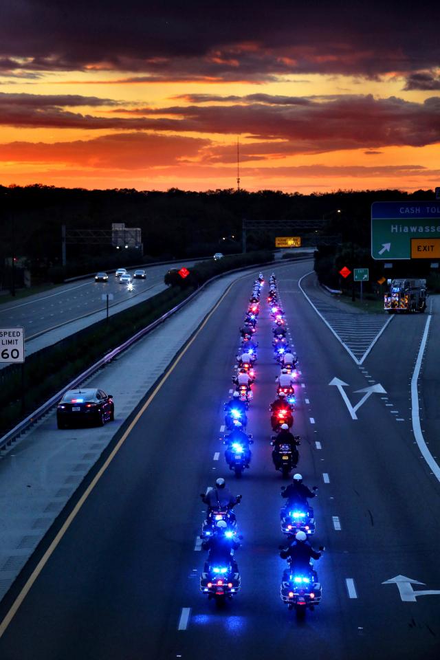 The procession escorting the hearse of slain Orlando Police Officer Debra Clayton