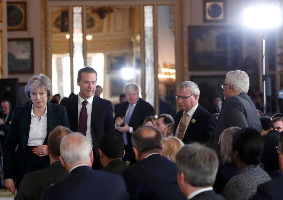 Boris Johnson applauds in the background after the PM delivered her Brexit strategy