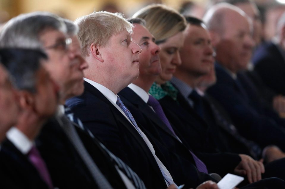 Boris Johnson watches the address flanked by Cabinet ministers
