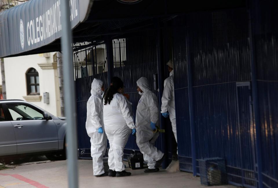  Forensic officers work at the scene of the school shooting