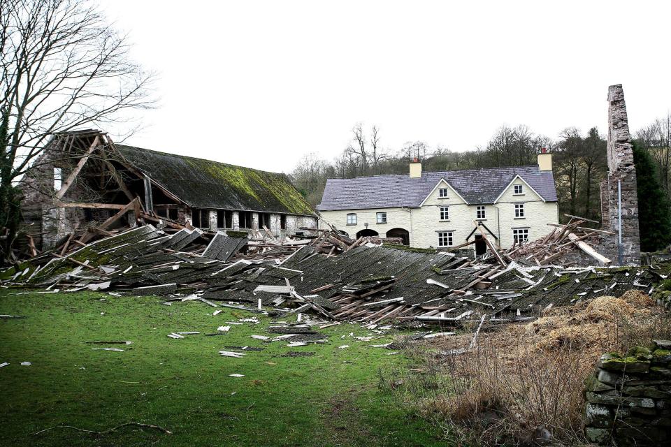  When the 350-year-old restored structure collapsed it destroyed vehicles inside