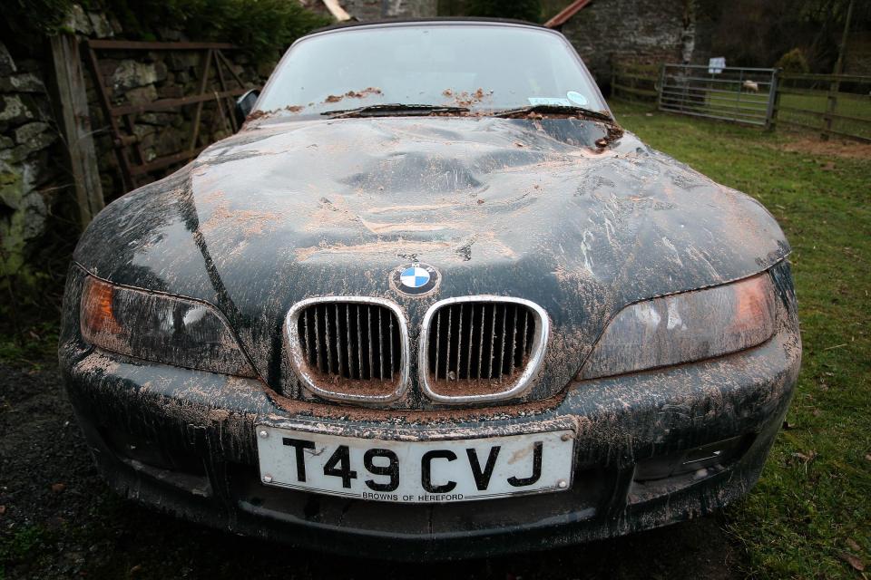  The couple's BMW was damaged when the barn came crashing down on top of it