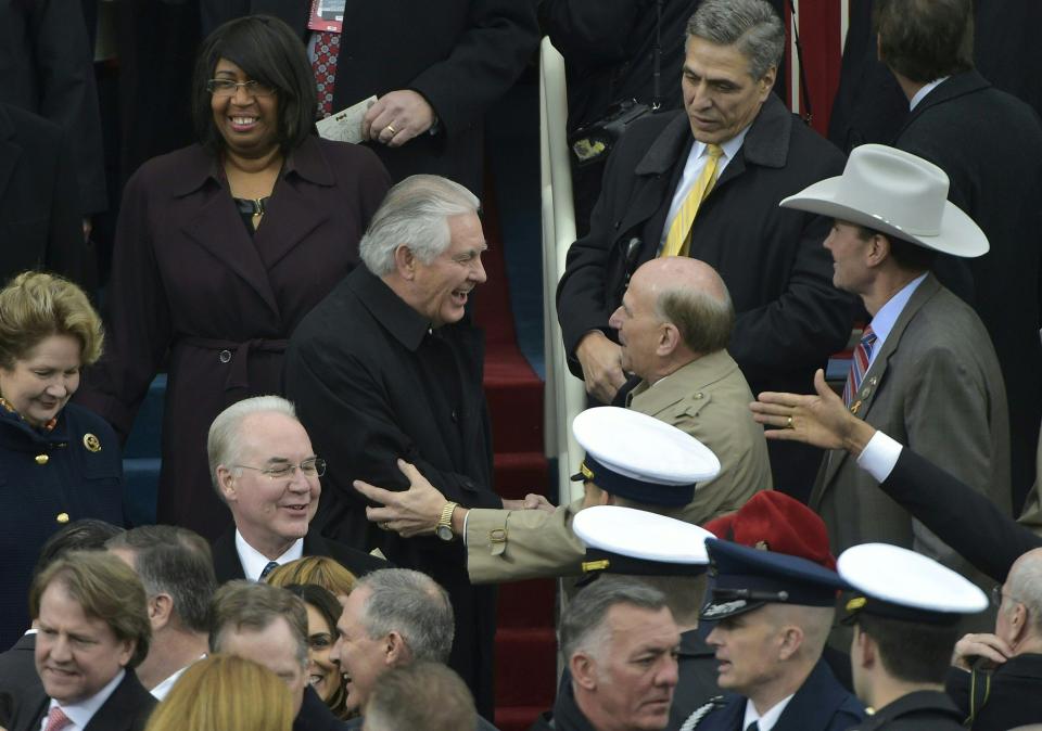  Tillerson is greeted on the platform ahead of Trump's inauguration on 20 January