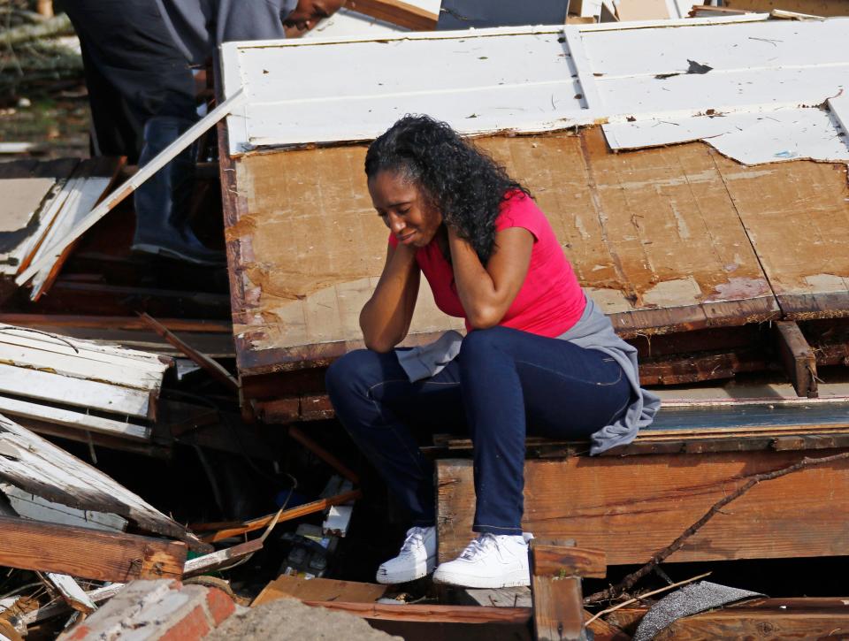 Shanise McMorris grieves on the slab of her Hattiesburg, Miss., home