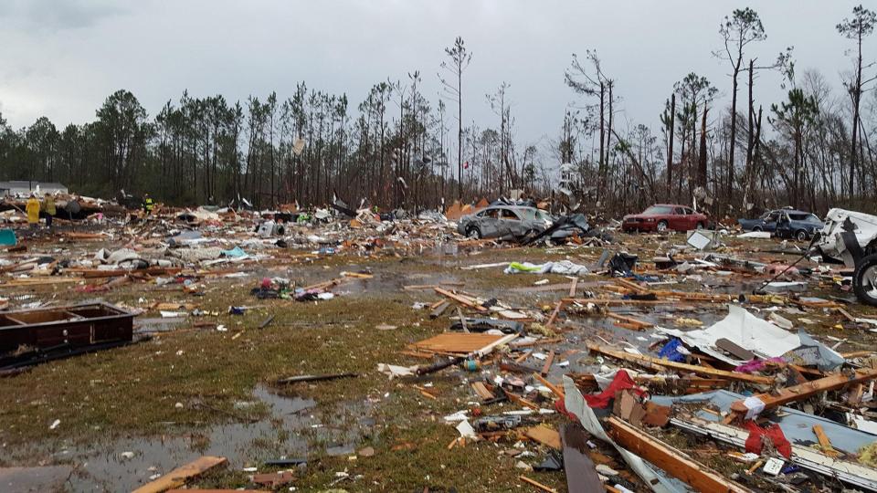 Debris covers an area of the Sunshine Acres neighbourhood after a tornado struck Adel, Georgia
