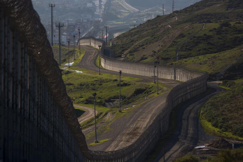 The US already has some 650 miles of fences and metal barriers along its border 