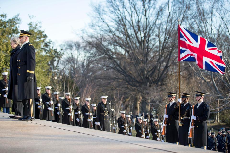  US troops held the US and UK flags as Mrs May laid her wreath at the Tomb of the Unknown Warrior