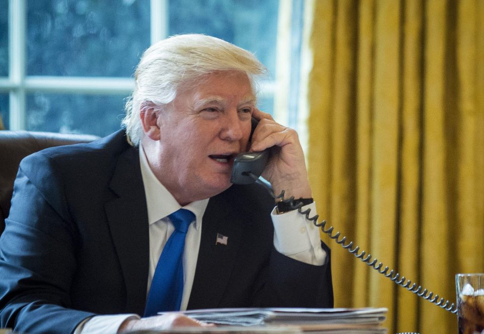 President Donald Trump on the phone to Russian leader Vladimir Putin
