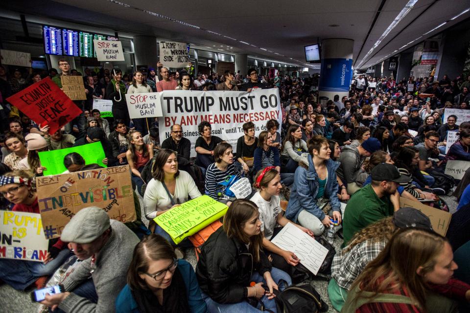  Demonstrators protest Trump's executive order which also halts a Syrian refugee programme