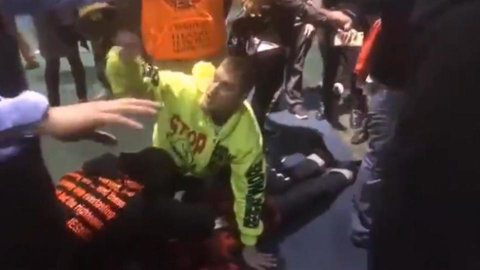 Some protesters tried to shield him from the mob