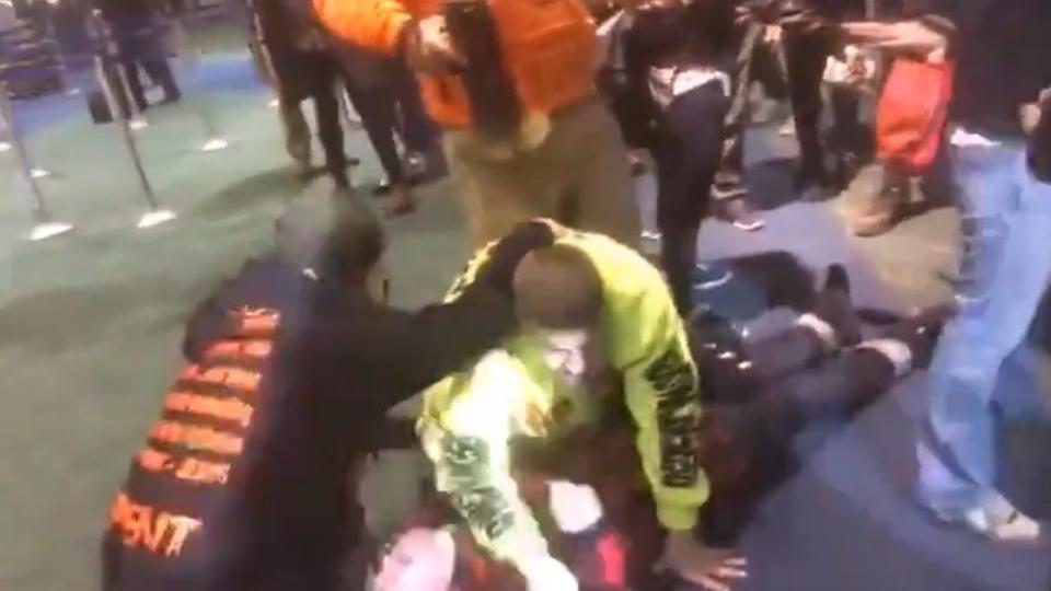 He fell to the ground with a loud thug before he was surrounded by protesters