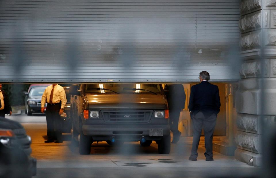  Roof was driven away under tight security after the hearing