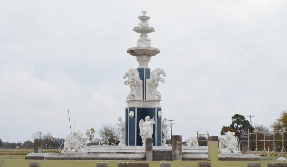 The water fountain has just been finished with the ominous statue of Poseidon