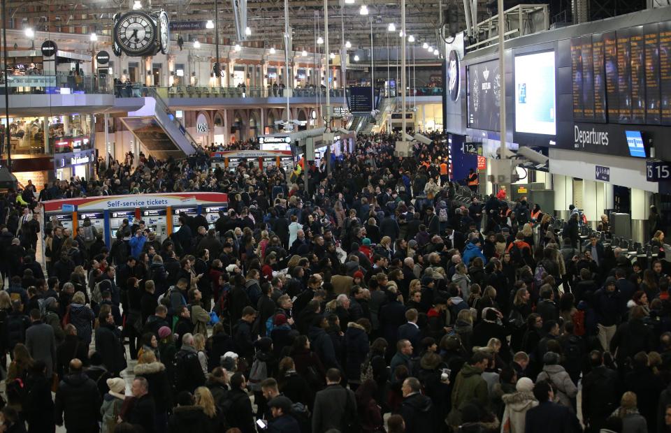  Commuters stand on the concourse at Waterloo station in central London on January 9, 2017, minutes before a 24-hour tube strike was due to end
