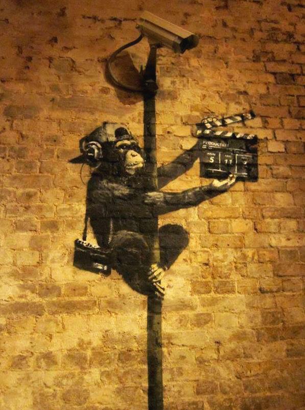 Banksy's satirical painting of a chimp is called Lights, Camera, Vandalism