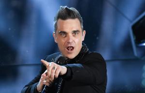 Robbie is due to perform but his back problems are causing issues