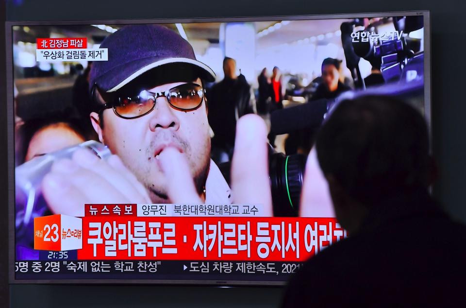 A South Korean man watches a television showing news reports about the death of Kim Jong-Nam