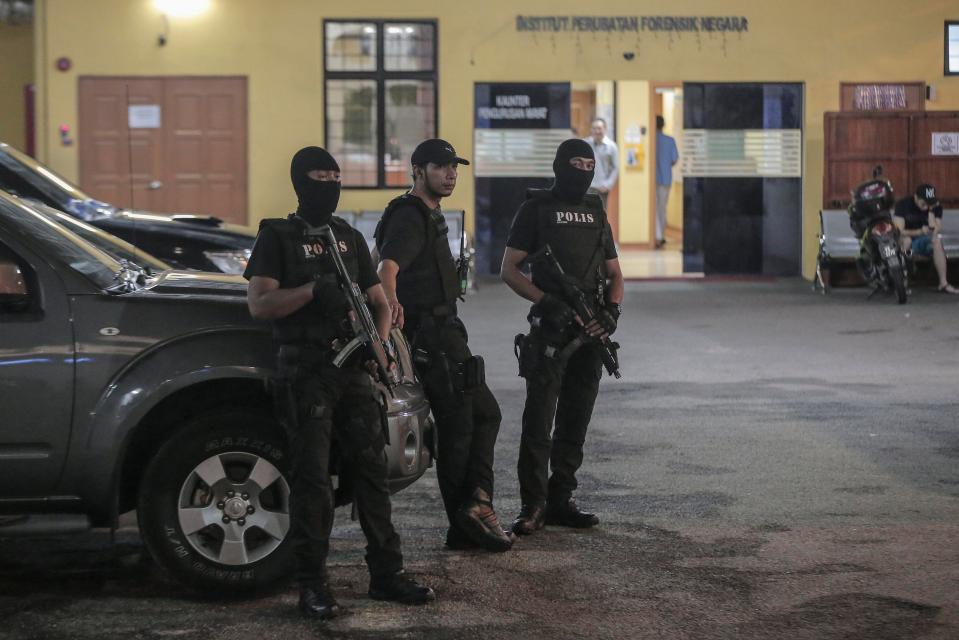 Officers stand guard around the clock at the morgue where Kim Jong-nam's body is being stored 