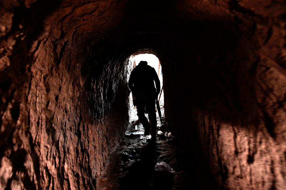 ISIS dug tunnels into the hill to plunder the ancient treasures within and sell them on the black market 