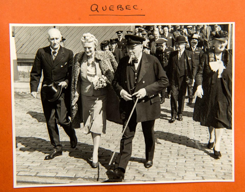  Churchill toots on one of his trademark cigars as he is joined by wife Clemmie at Quebec conference