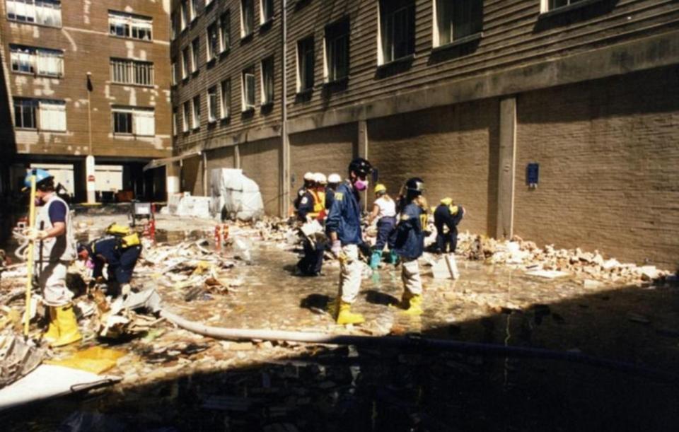  Workers begin the task of rebuilding the iconic complex. Staff moved back in to the site where the plane struck within a year