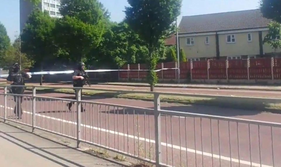  The Army was drafted in to help armed cops investigate a report of a suspicious package in an area of Manchester this morning