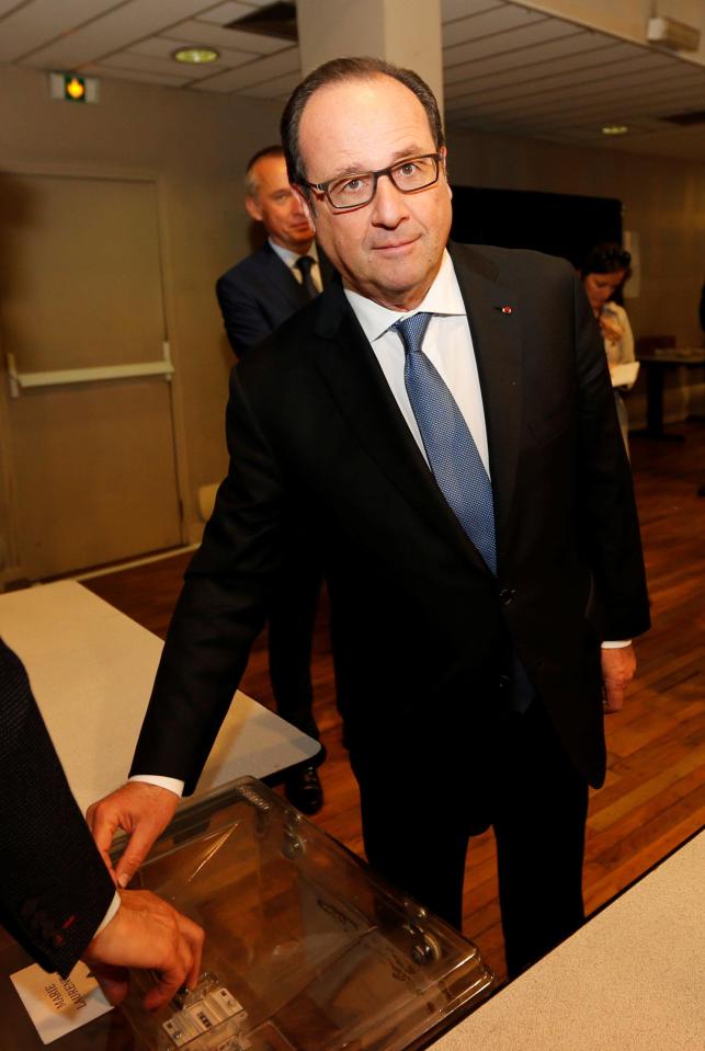  Outgoing French President Francois Hollande casts his vote at a polling station in Tulle