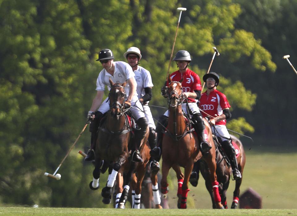  In it to win it ... Prince William, front left, and Prince Harry, back left, stormed to victory in the match