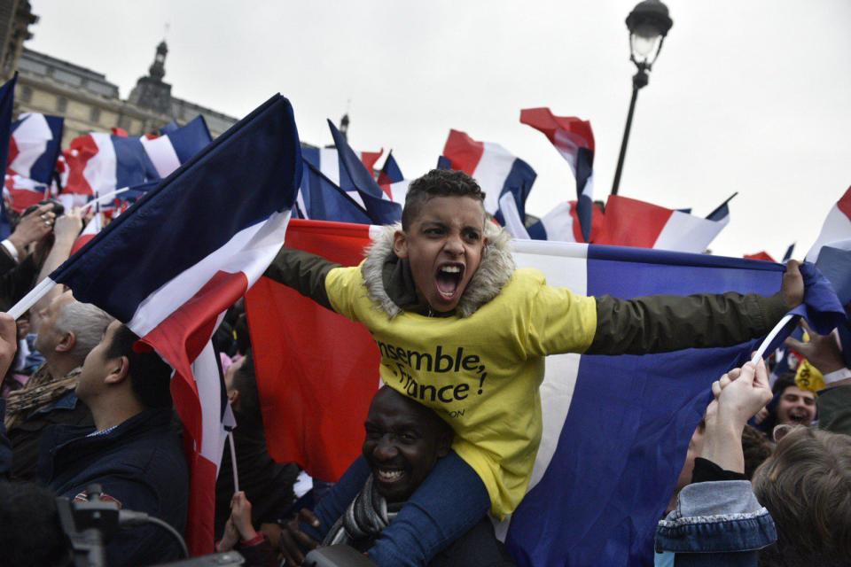 The centrist candidate's supporters appear overjoyed after he crushed Marine Le Pen in the presidential election