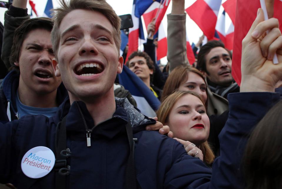  A huge crowd of people supporting President Macron gather outside the Louvre museum in Paris