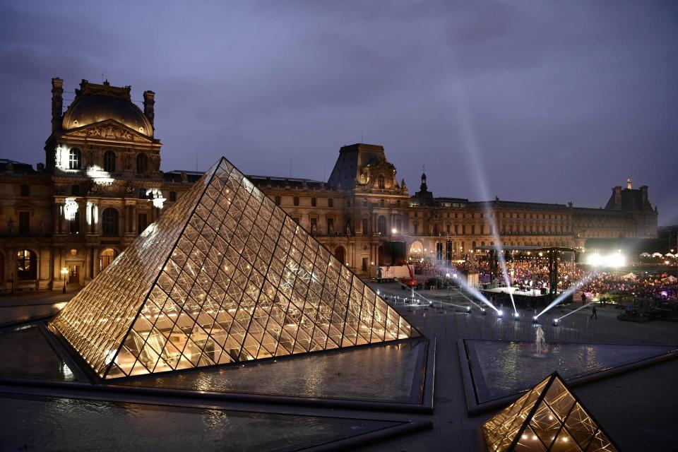  The iconic Pyramid at the Louvre Museum was packed as dozens of people celebrated the election result in Paris