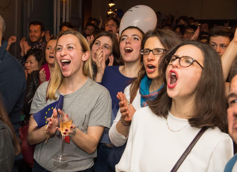 Dozens of French citizens at the Square Pig pub in Holborn in London reacted with cheers after Macron was named the new President