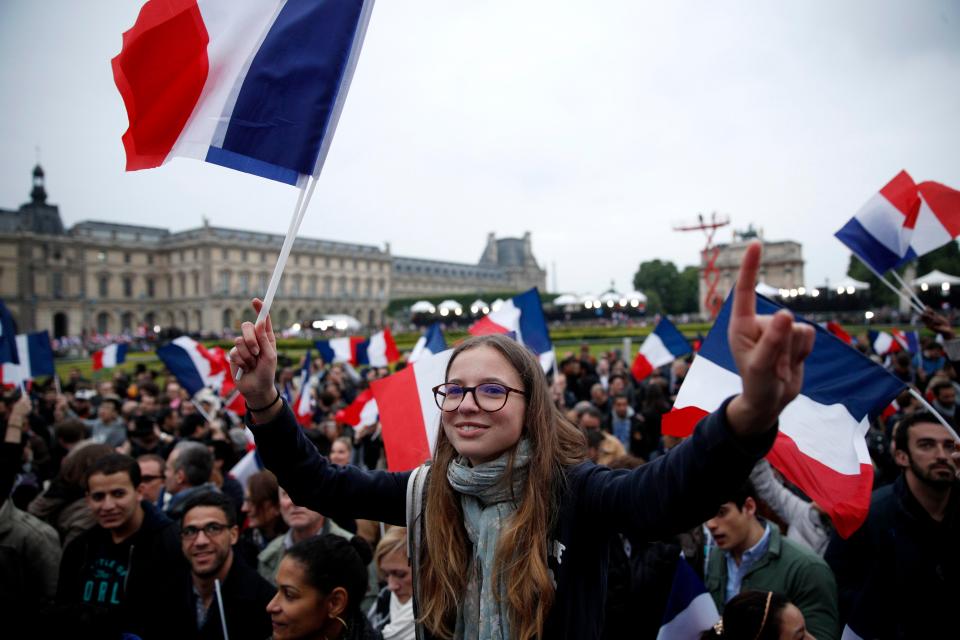  A sea of French flags waved in the air outside the Louvre Museum in Paris after the results was announced this evening