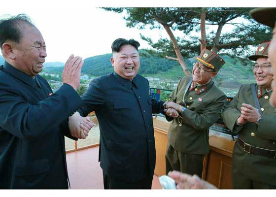  The dictator celebrates with his generals after successfully launching a ballistic missile