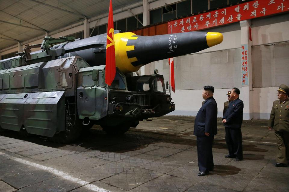 Kim Jong-un inspects one of his new Hwasong-12 missiles 