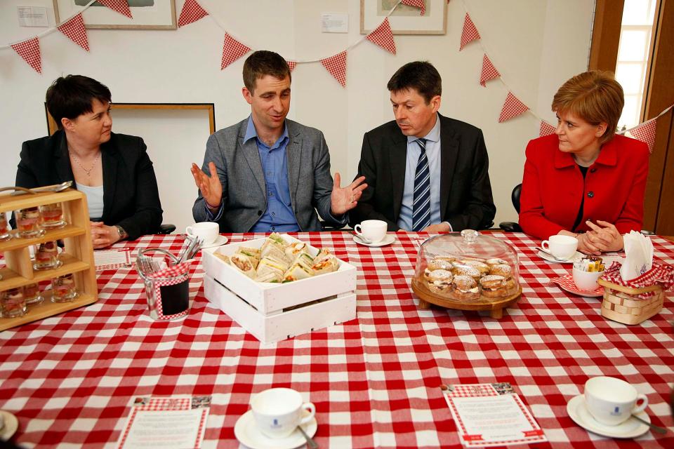  Brendan Cox, second from left, speaks to Scottish Conservative leader Ruth Davidson (left), presiding officer Ken Macintosh and First Minister Nicola Sturgeon (right)