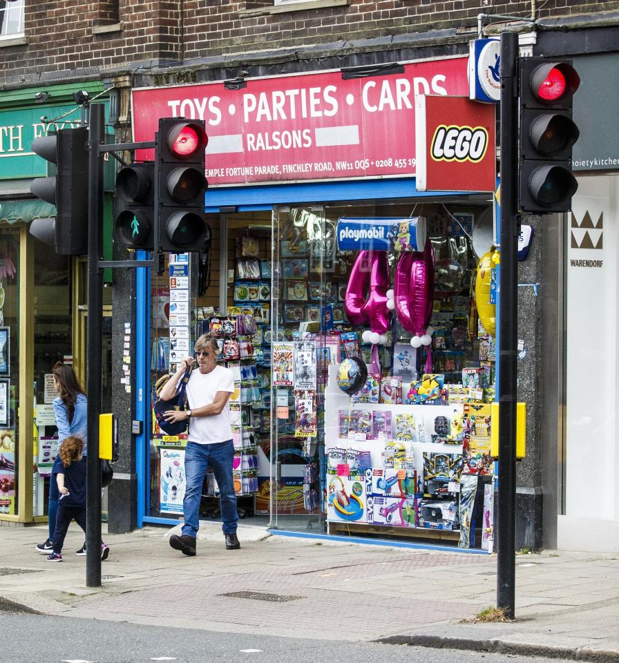  The telly presenter emerged from a card shop on the exact date she turned 69 with a bag of shopping slung over his shoulder
