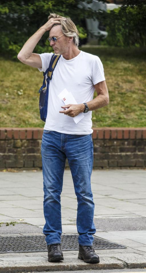  The dad-of-two ruffled his hair and seemed confused as he crossed the road
