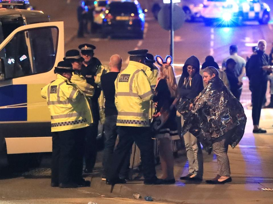 Police talk to victims after the terror attack on Manchester Arena