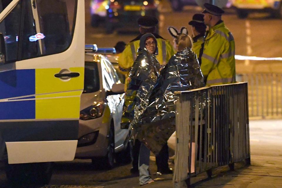  Party-goers comforted by cops after the blast