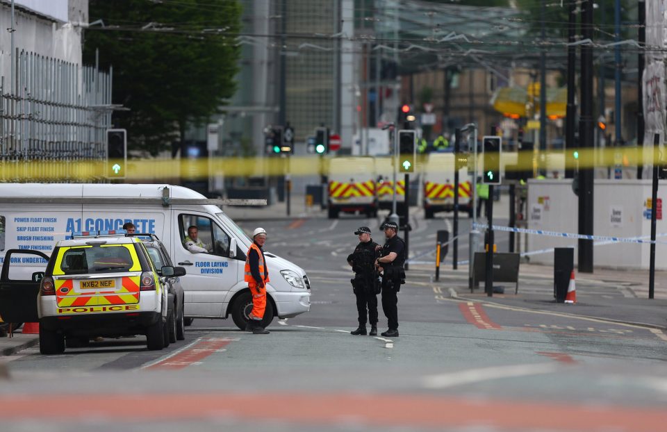 Armed cops continue to patrol the streets on the morning after the terror attack