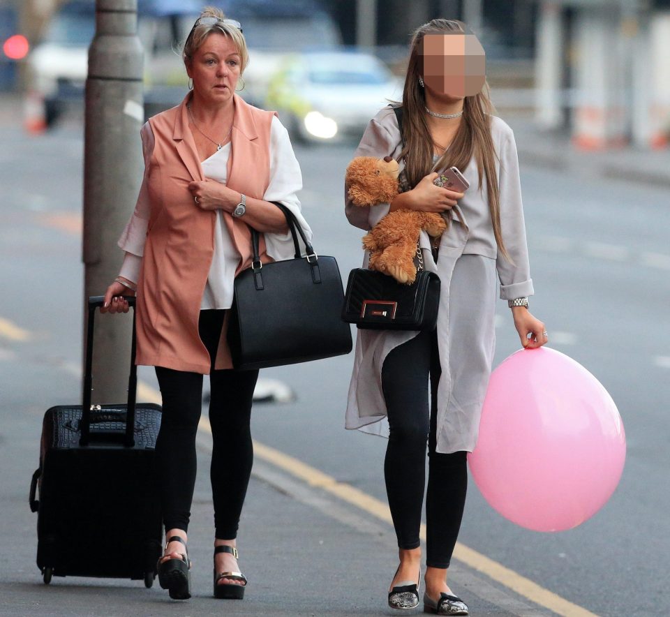 Walking casualties leave a nearby hotel this morning after being taken in after the attack last night