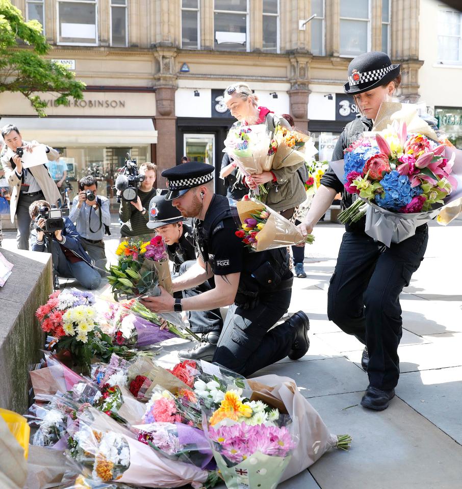  Police officers lay wreaths in Albert Square, Manchester