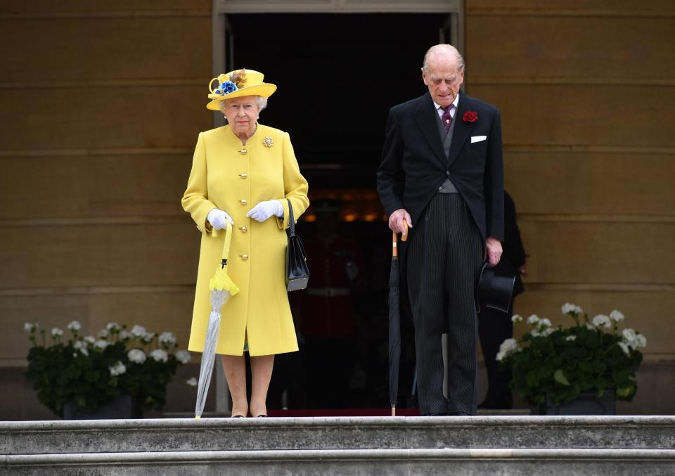  The Queen and the Duke of Edinburgh observed a minute's silence at the start of a garden party at Buckingham Palace