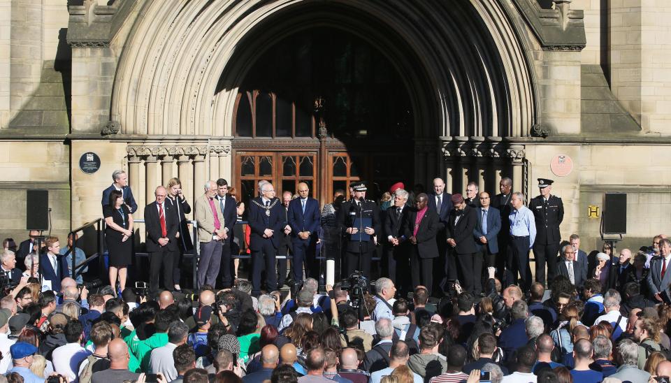 Civic leaders and politicians listen as Greater Manchester Police chief constable Ian Hopkins (centre) speaks during the vigil